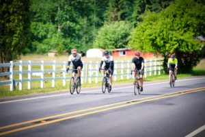4 bikers riding down the road