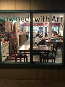 looking through a window at the inside of a cafe