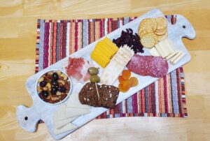 Cheese and meat with crackers, nuts and dried fruit